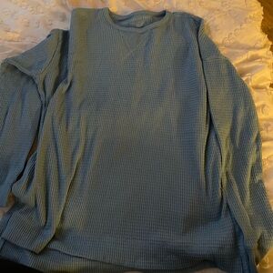 size S. sweater. light blue. no letter/graphics on it.